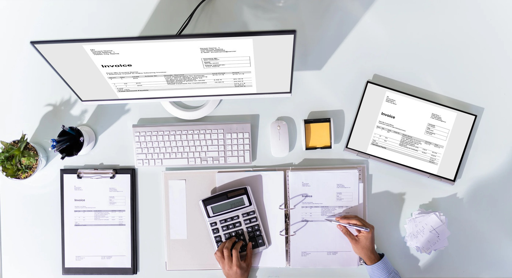 an image of an office desk with a laptop, keyboard, and paper. contact page graphic